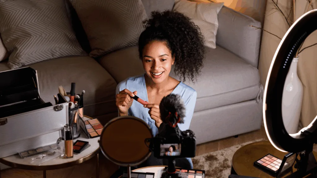 A lifestyle influencer recording a makeup review reflecting modern monetization methods in the 2026 creator economy.
