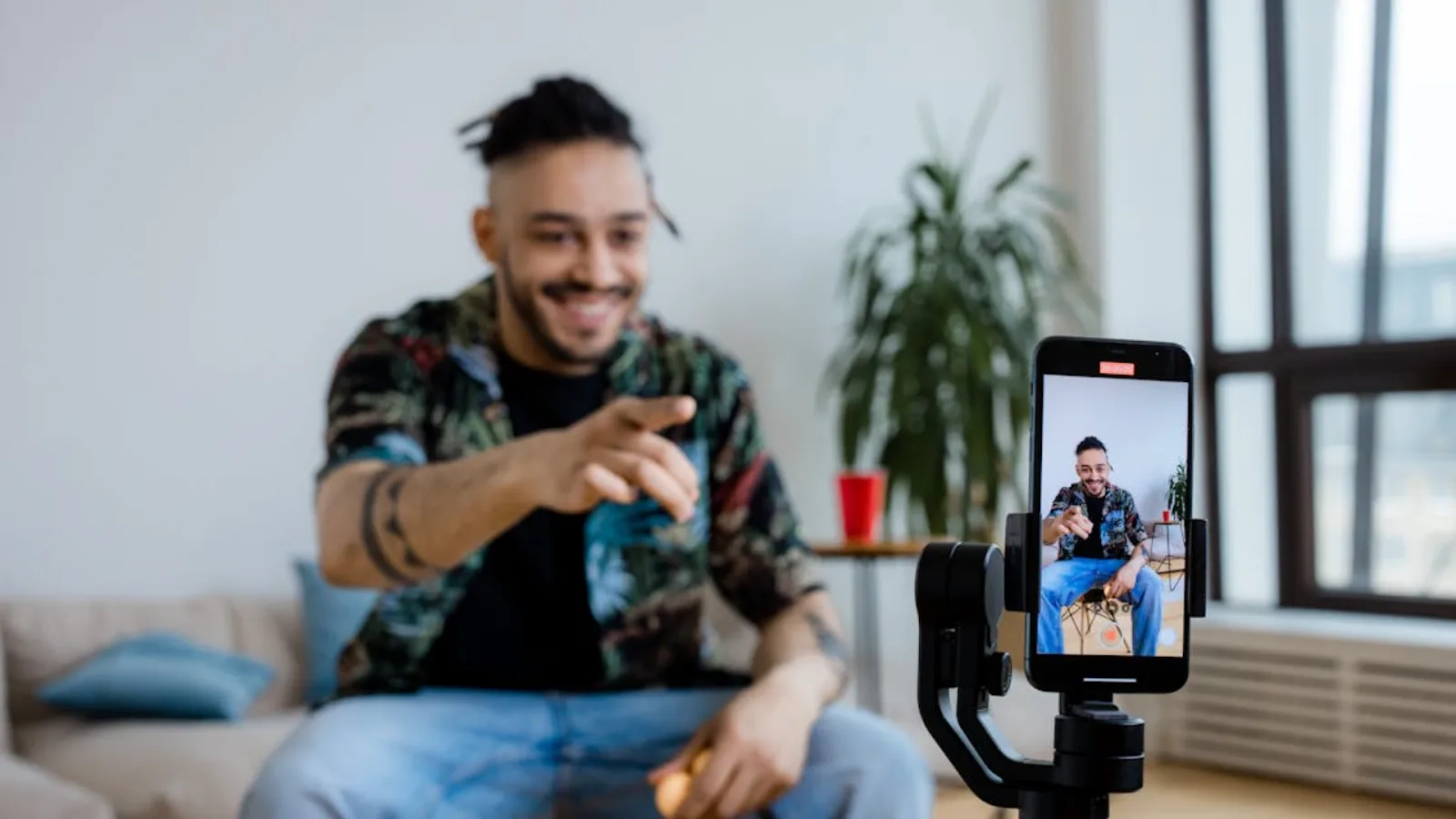 Content creator filming a TikTok video with a phone on a tripod