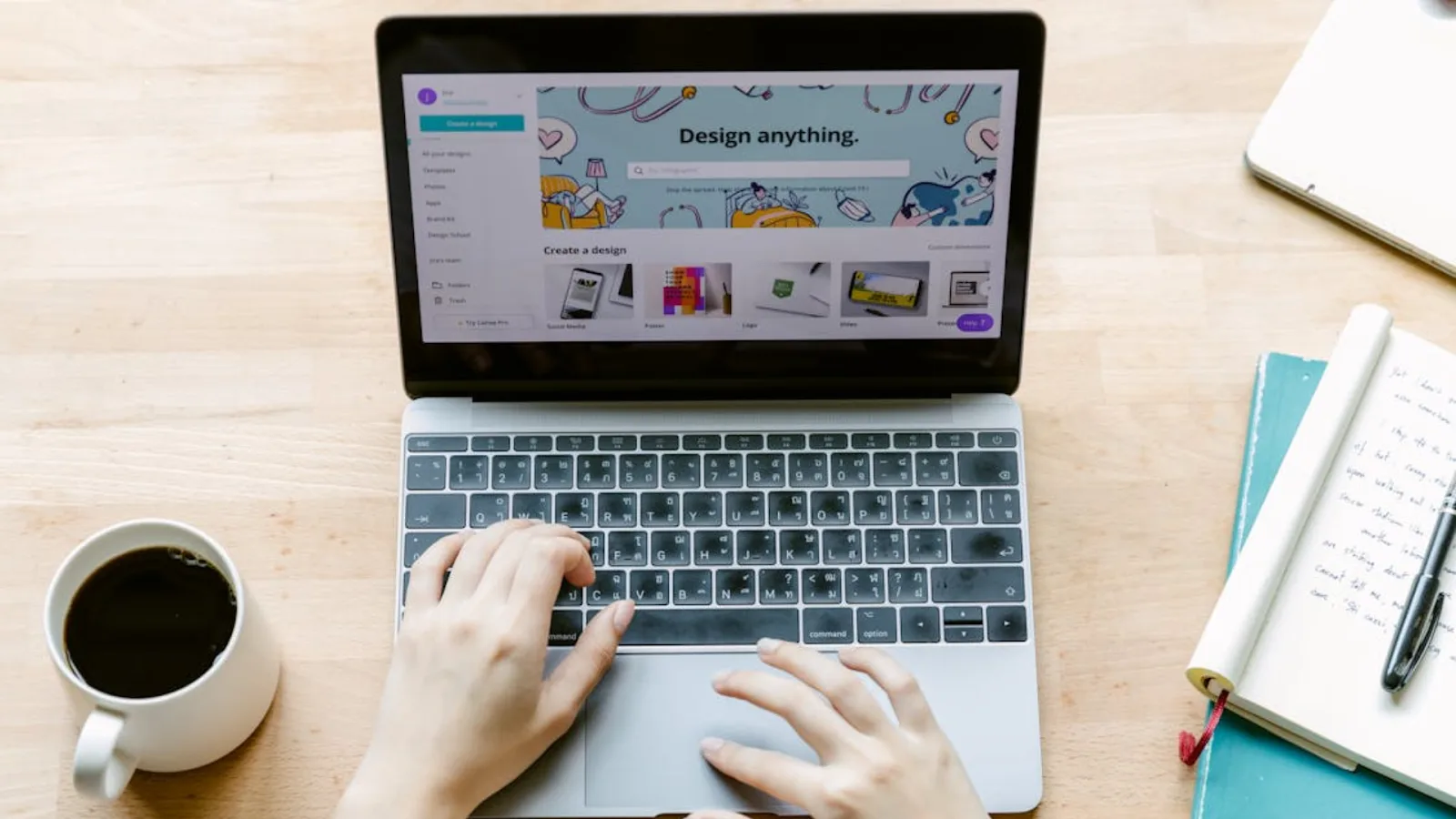 Person creating digital designs on a laptop as part of a creative side hustle idea