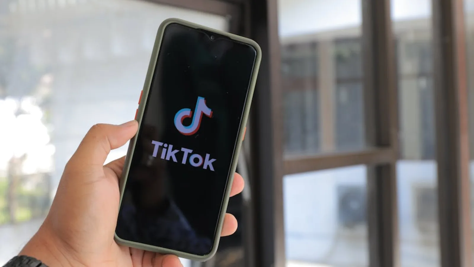 Phone displaying TikTok app, related to how to monetize TikTok in 2026