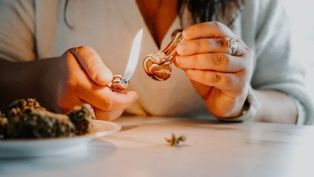 Cannabis lifestyle content showing hemp flower and pipe use