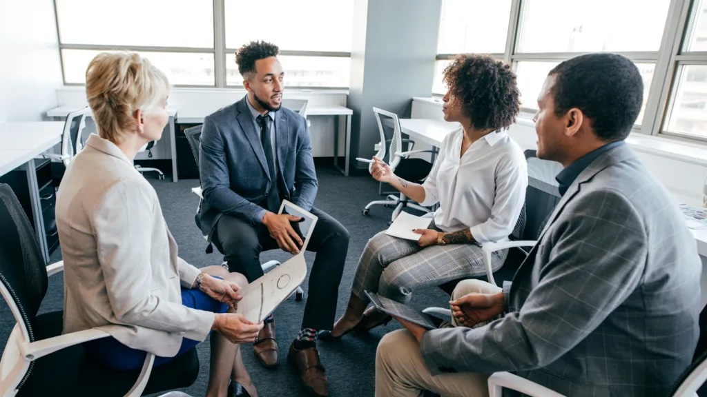 Professionals in a small group discussion building trust and communication