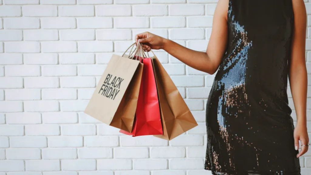 Shopping bags held by a brand ambassador at an event